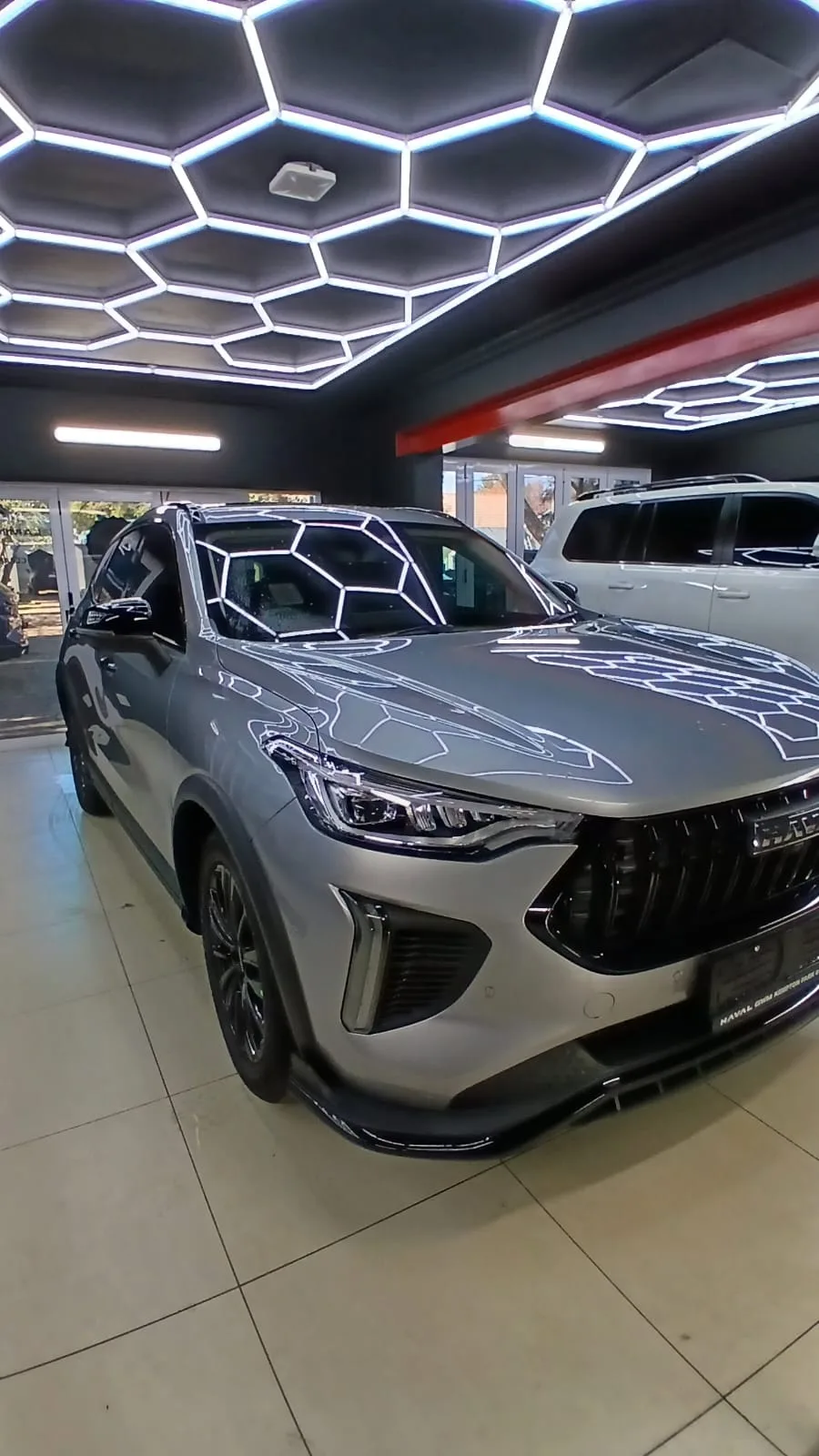 Silver SUV photographed inside the ClearGuard workshop