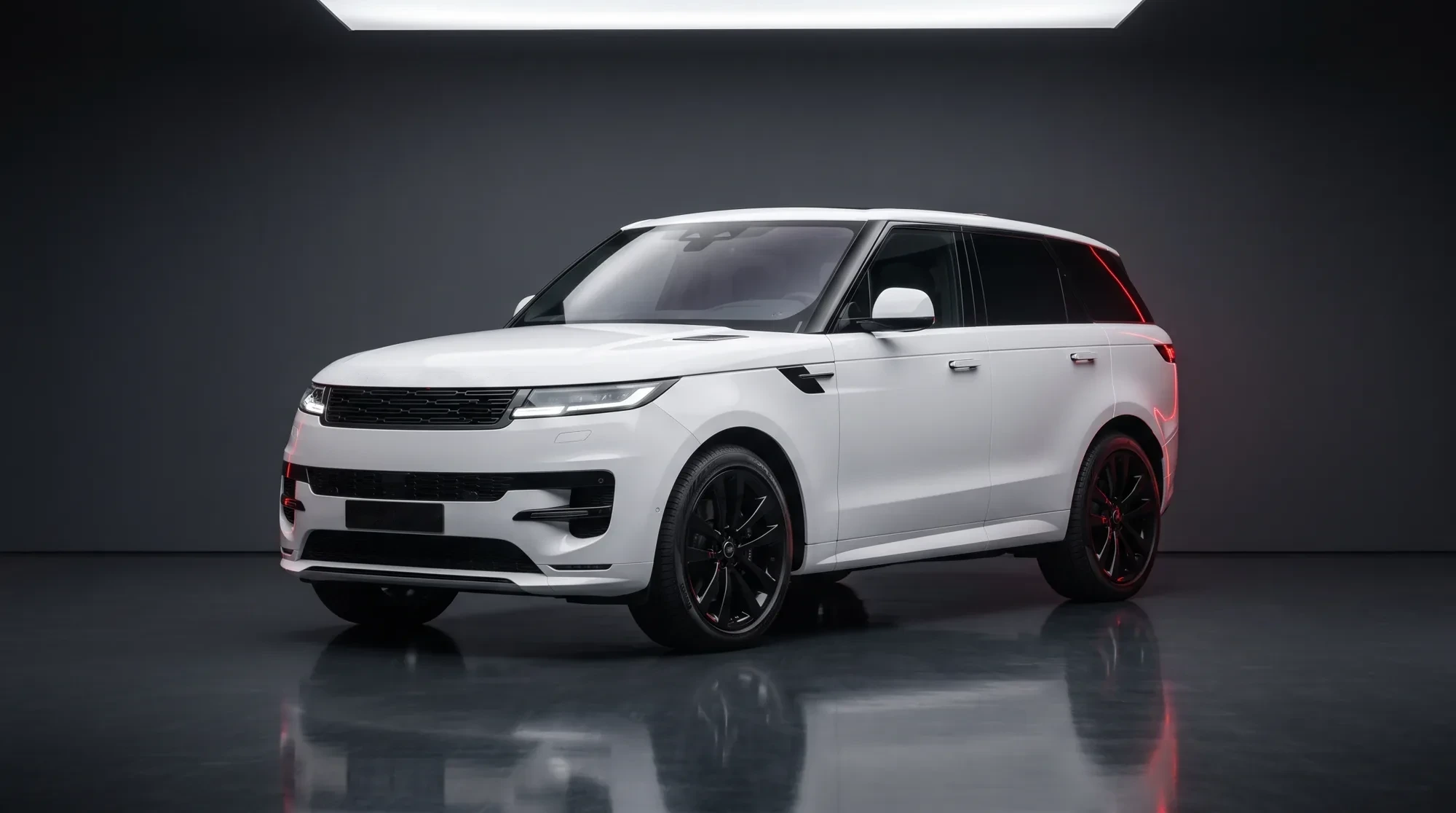 White Range Rover Sport in a dark studio