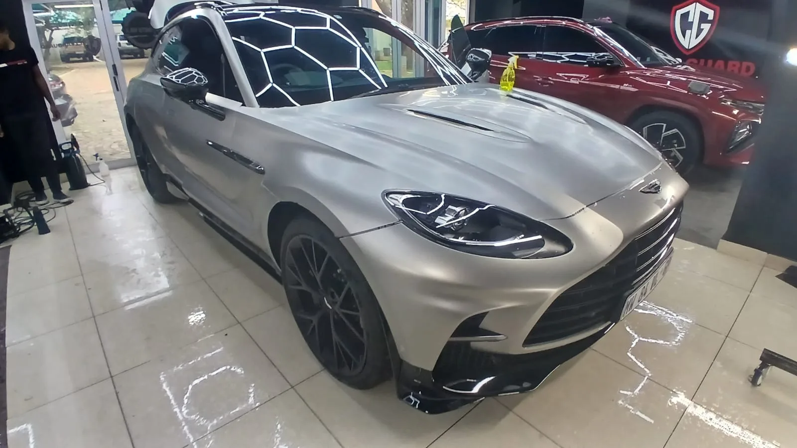 Silver Aston Martin in the ClearGuard workshop